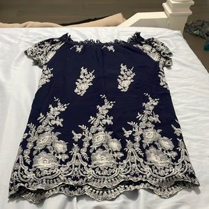 A navy blue and white floral dress